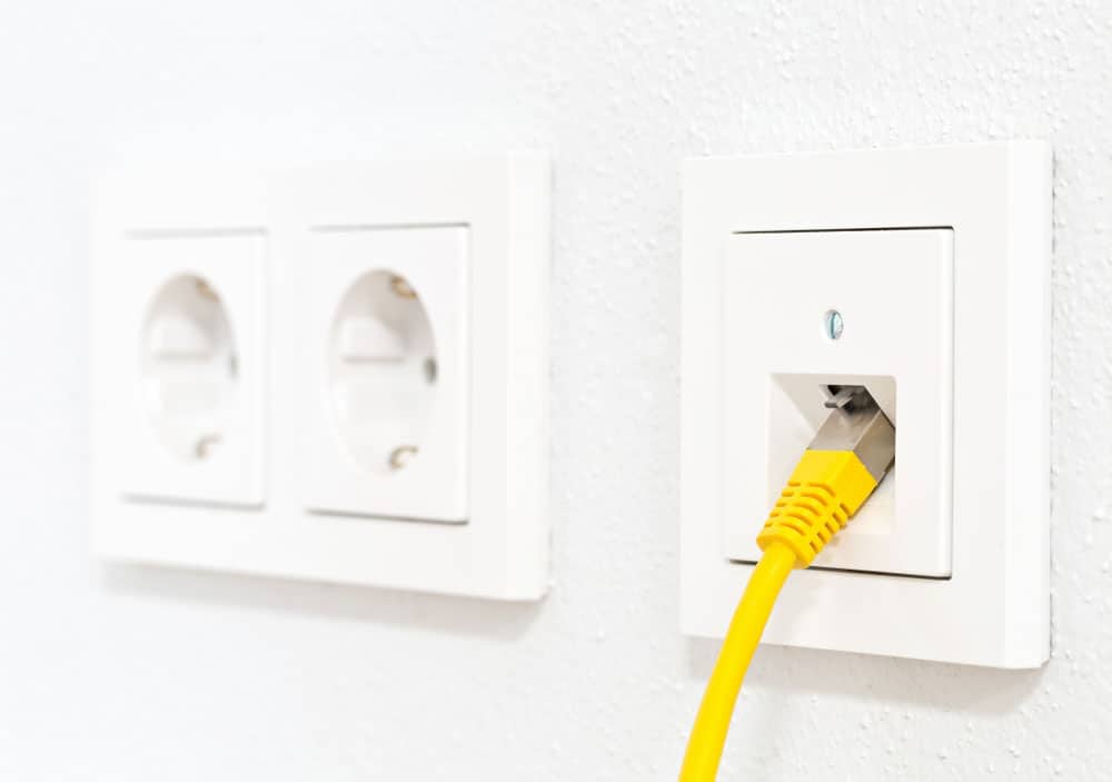 A network cable in a wall outlet