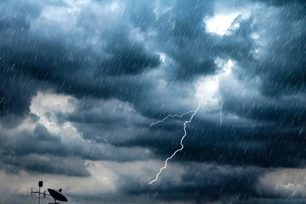 Lightning and thunderstorm flash with raining background