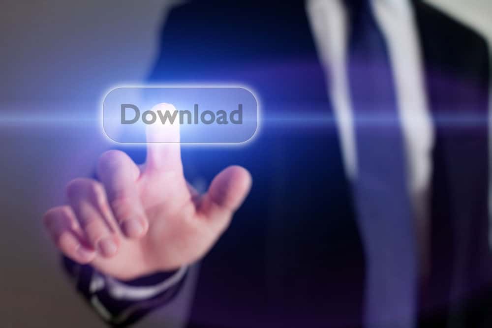 Businessman pressing download