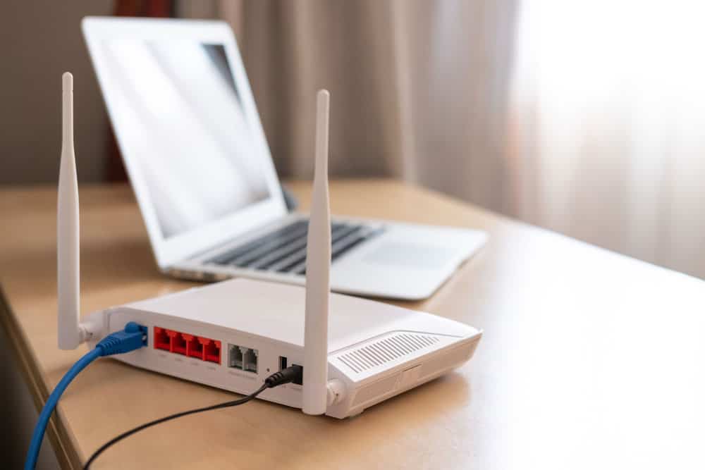 A Wi-Fi router connected to an ISP via an ethernet cable