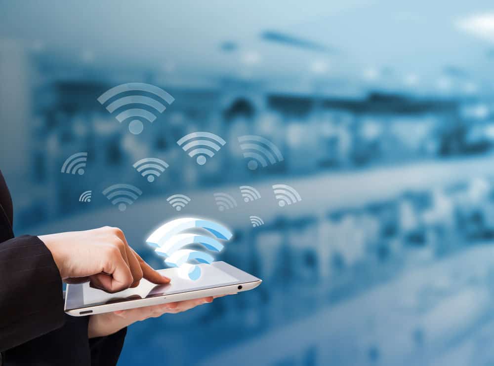 Businesswoman connecting to WIFI