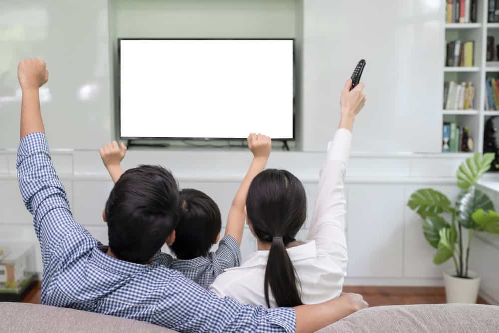Man and woman watching TV together