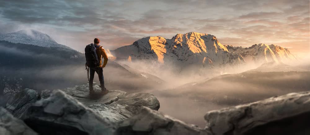 A Hiker on a Mountainous Trail. 