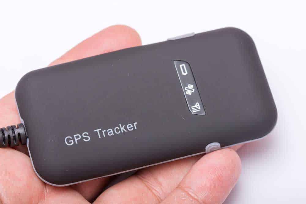 Holding a commercially available GPS tracker