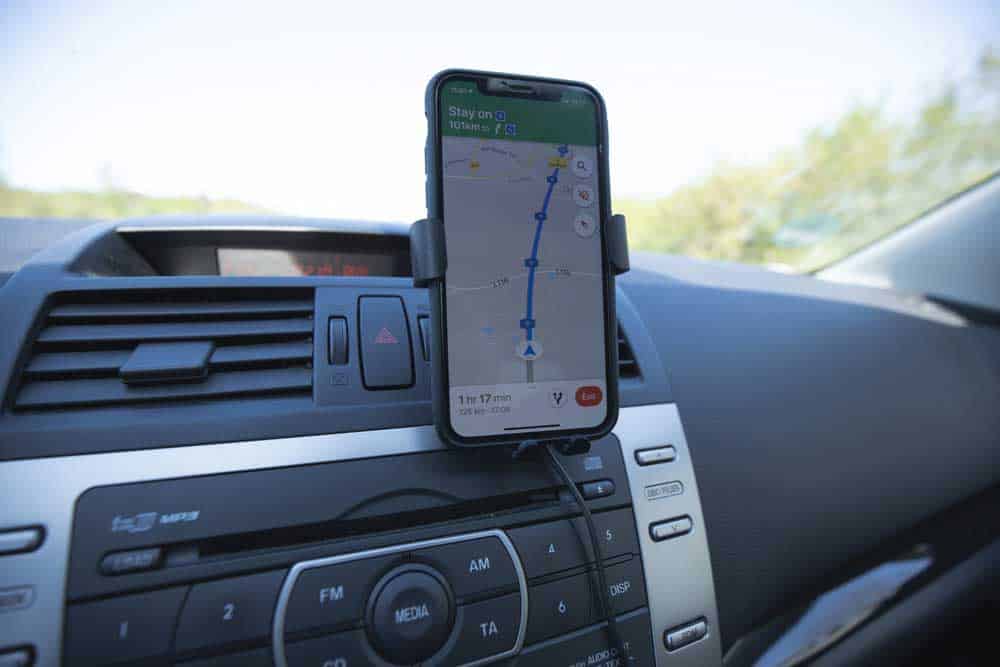 iPhone with navigation through Google Maps on the Dashboard