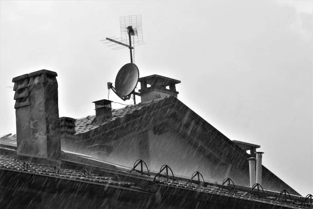 The roof of a house under the heavy rain