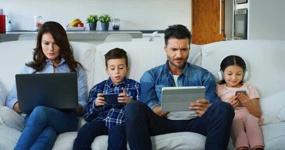 Four family members using the internet on different devices