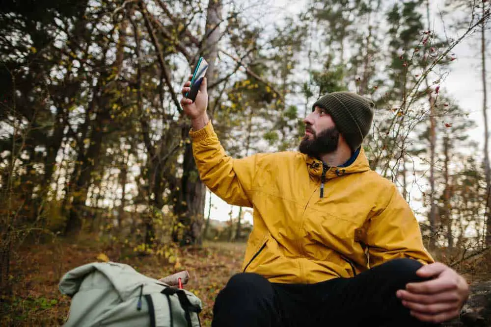 A man uses a Standard Positioning Service mobile phone