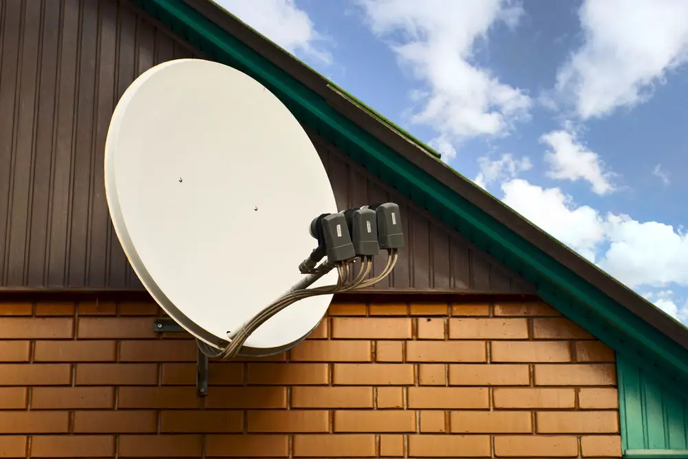 A satellite dish with three LNBs