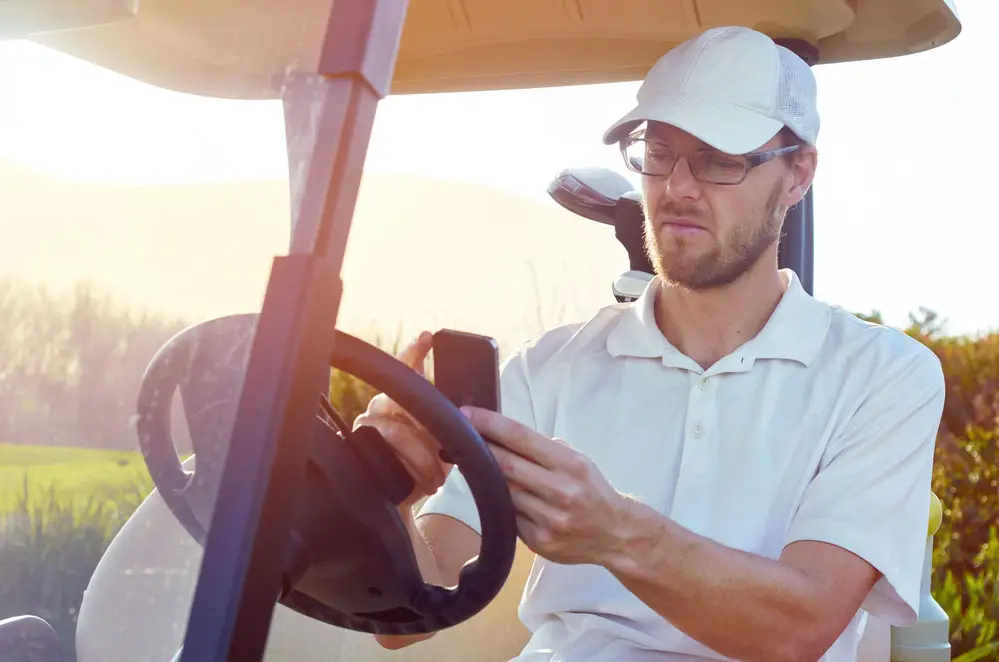 Golfer analyzing a golf course