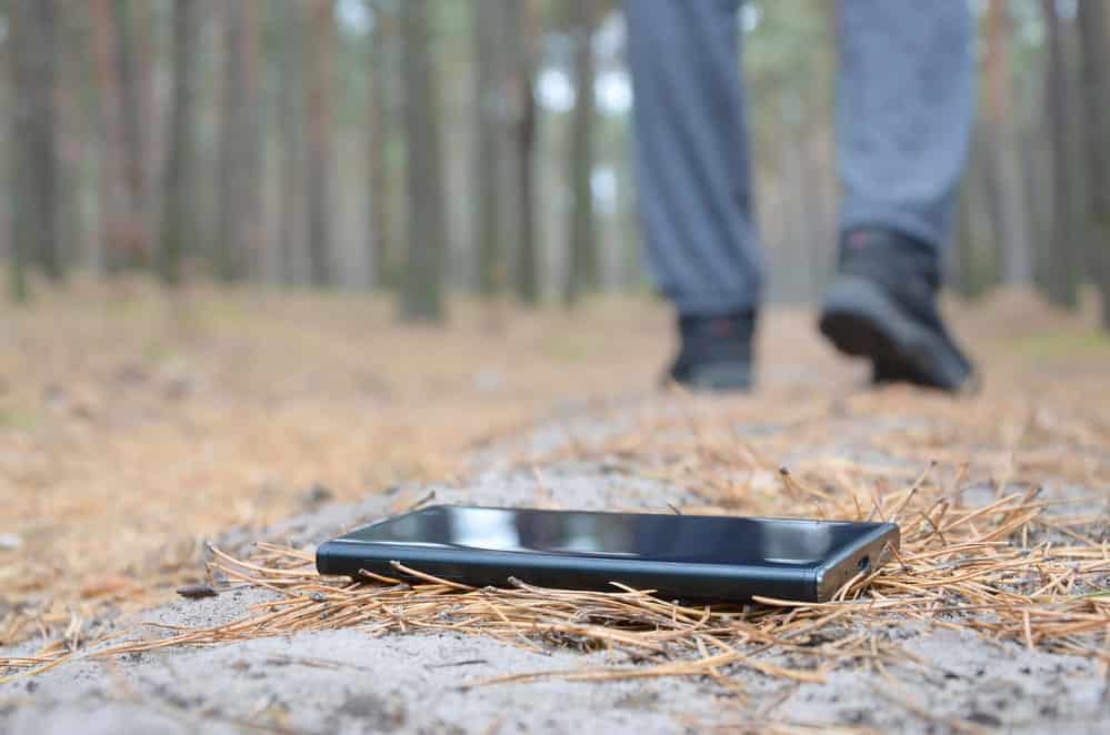 A lost phone on a wood path