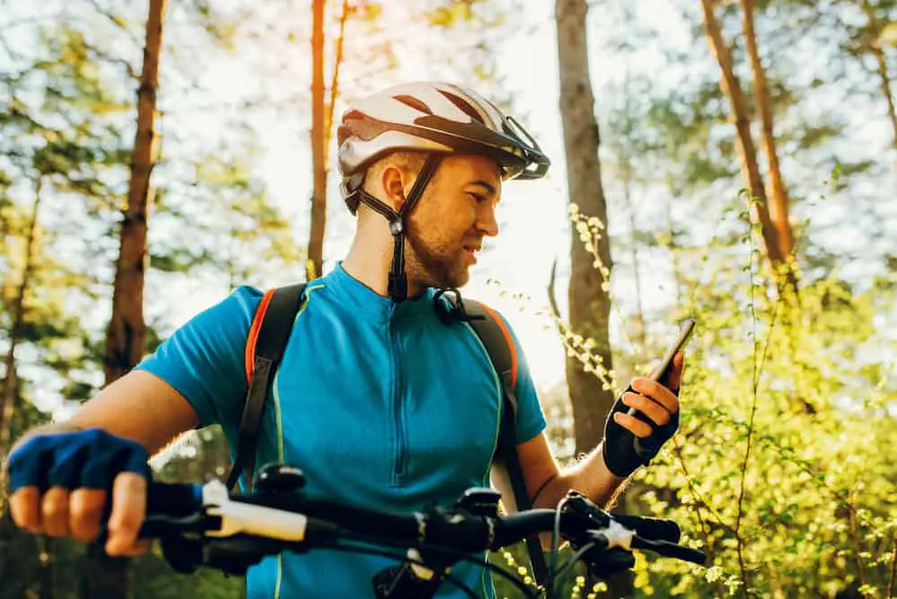 Cyclist using navigator on smartphone