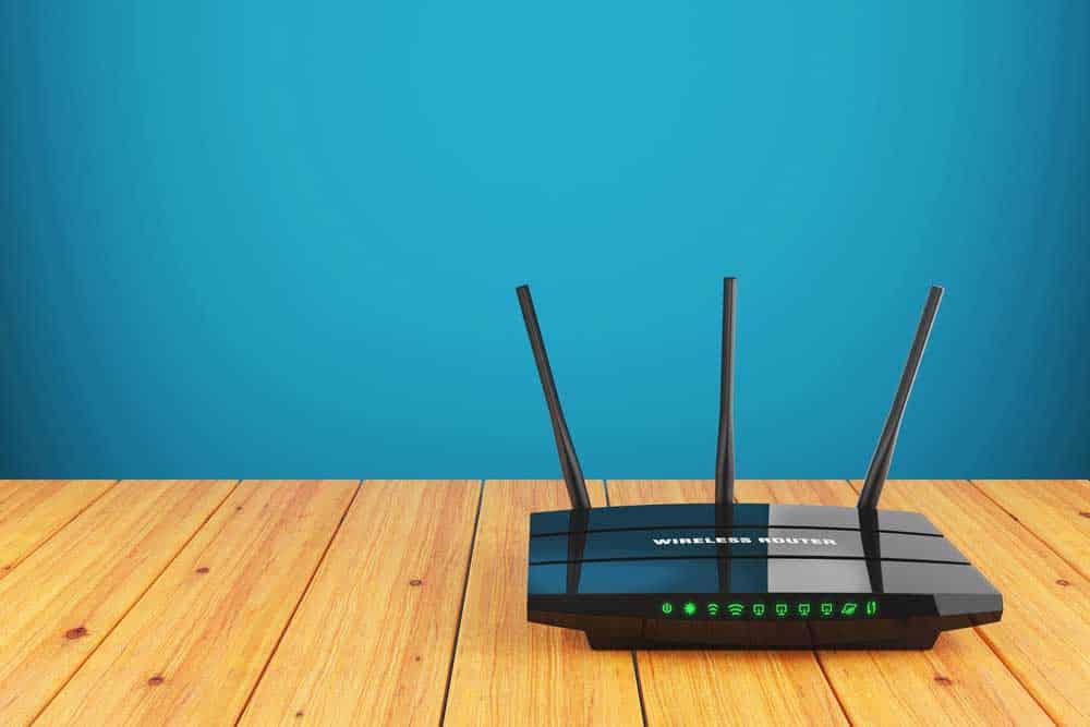 Wi-Fi wireless router on the wooden table