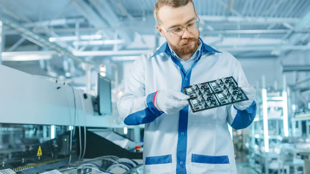 An engineer doing a PCB inspection