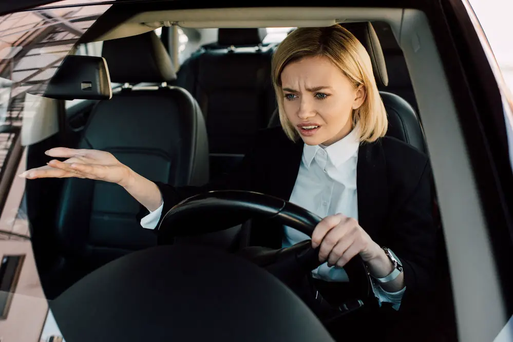 An upset lady driving