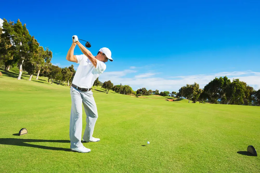 Man playing golf on a golf course