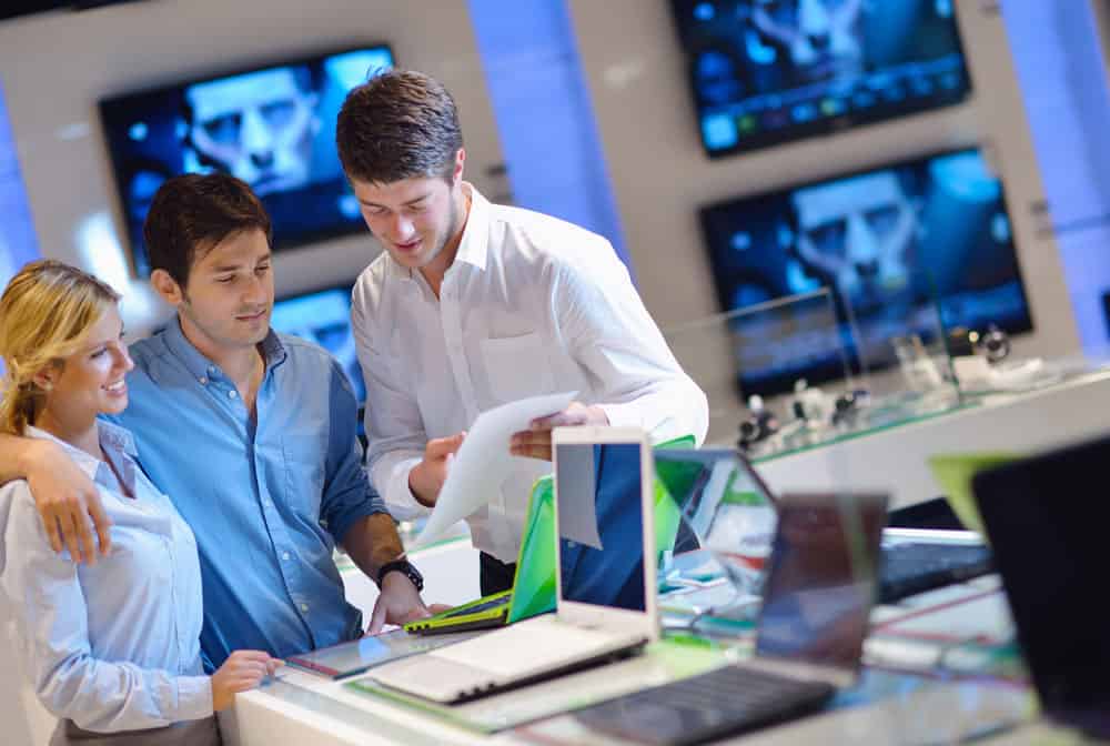 Buyers in a consumer electronics retail store