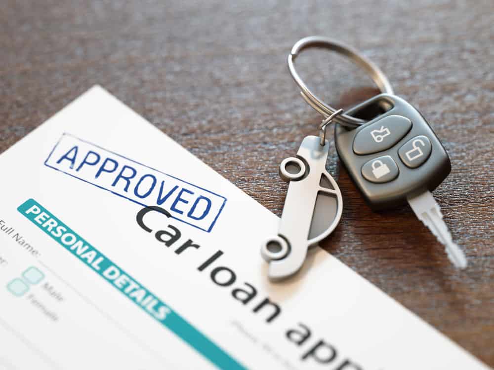 An approved car loan application with the personal details form showing