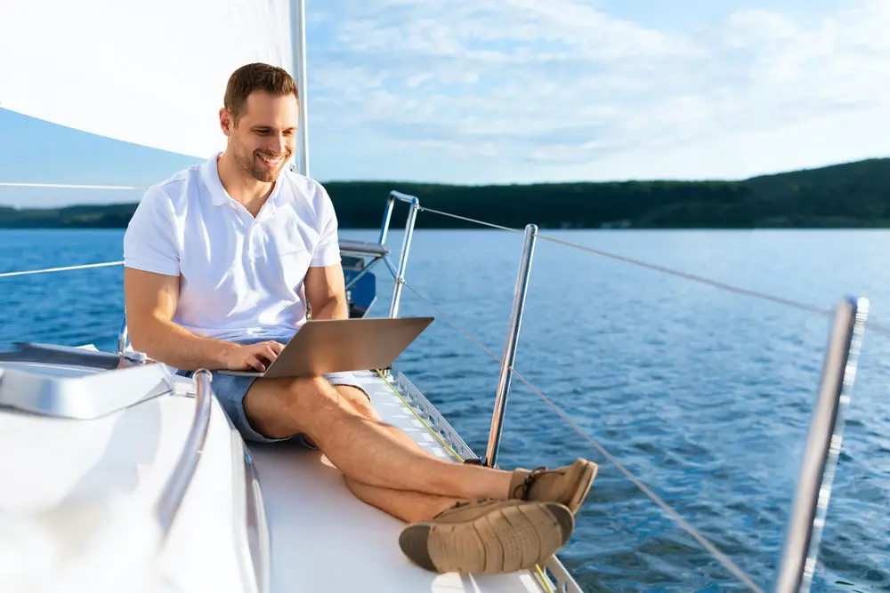 Enjoying the internet in a yacht. 
