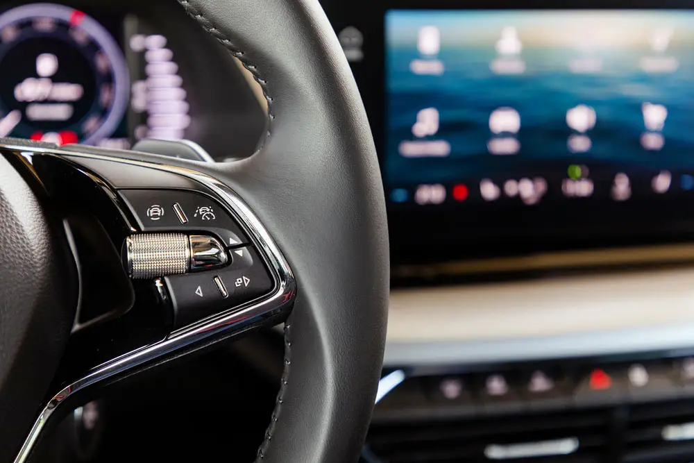 Buttons on a steering wheel for controlling the infotainment system