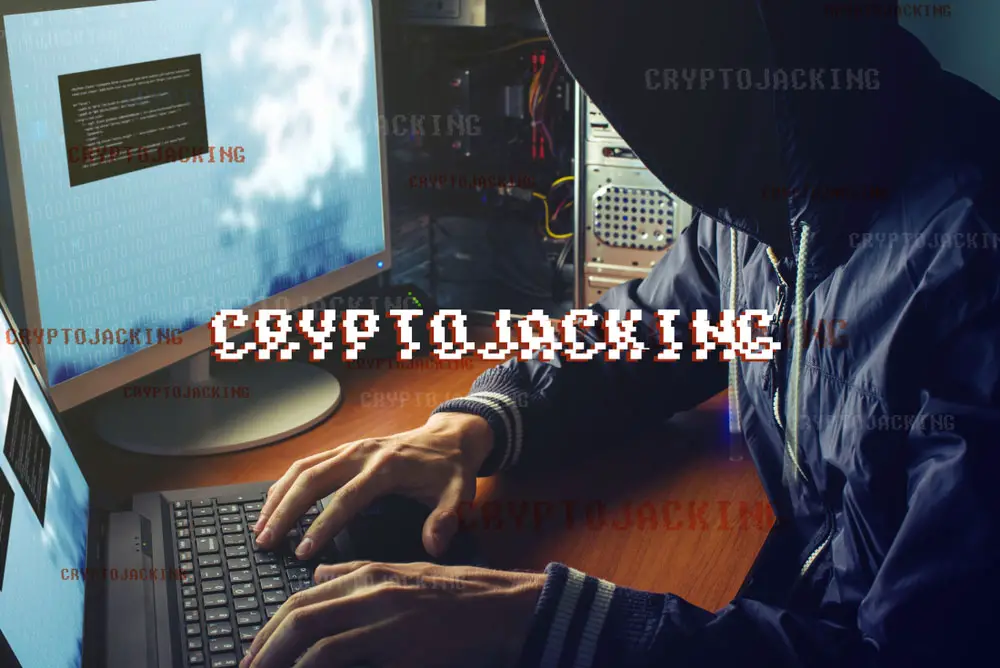 An anonymous hacker engaging in cryptojacking