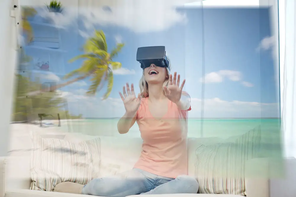 Happy young woman wearing the virtual headset