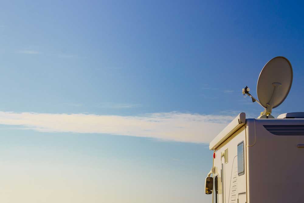 A satellite dish on top of an RV
