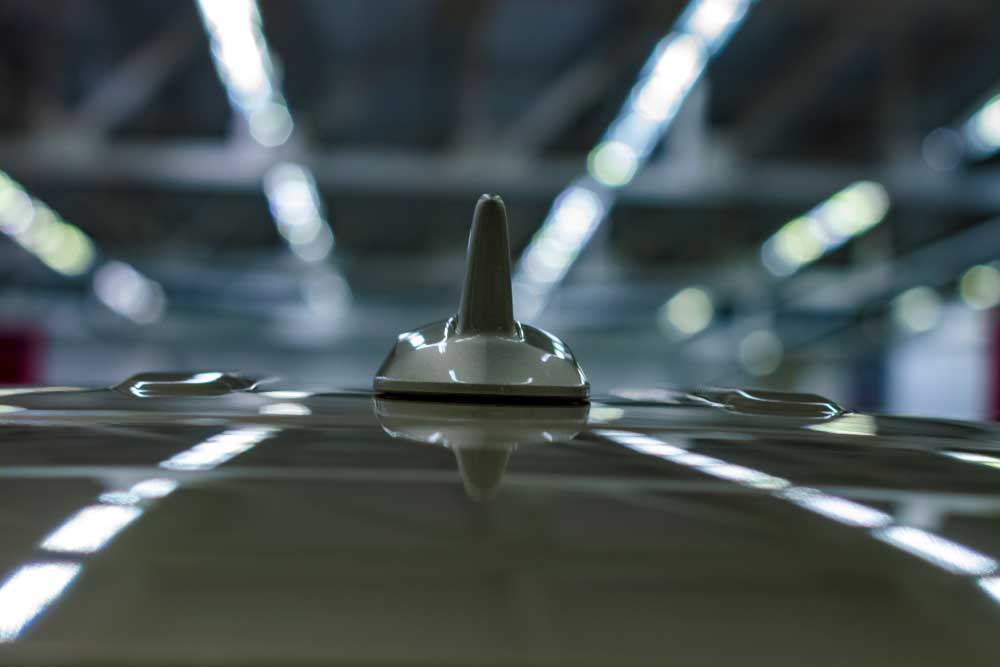 A shark fin antenna on car roof