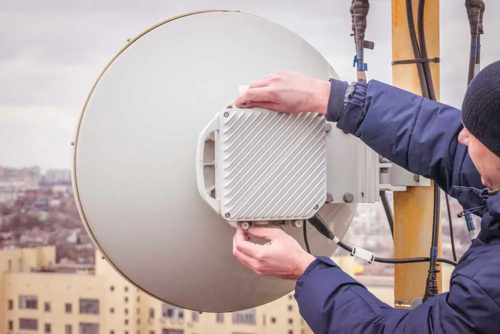 A man maintaining a power radio relay