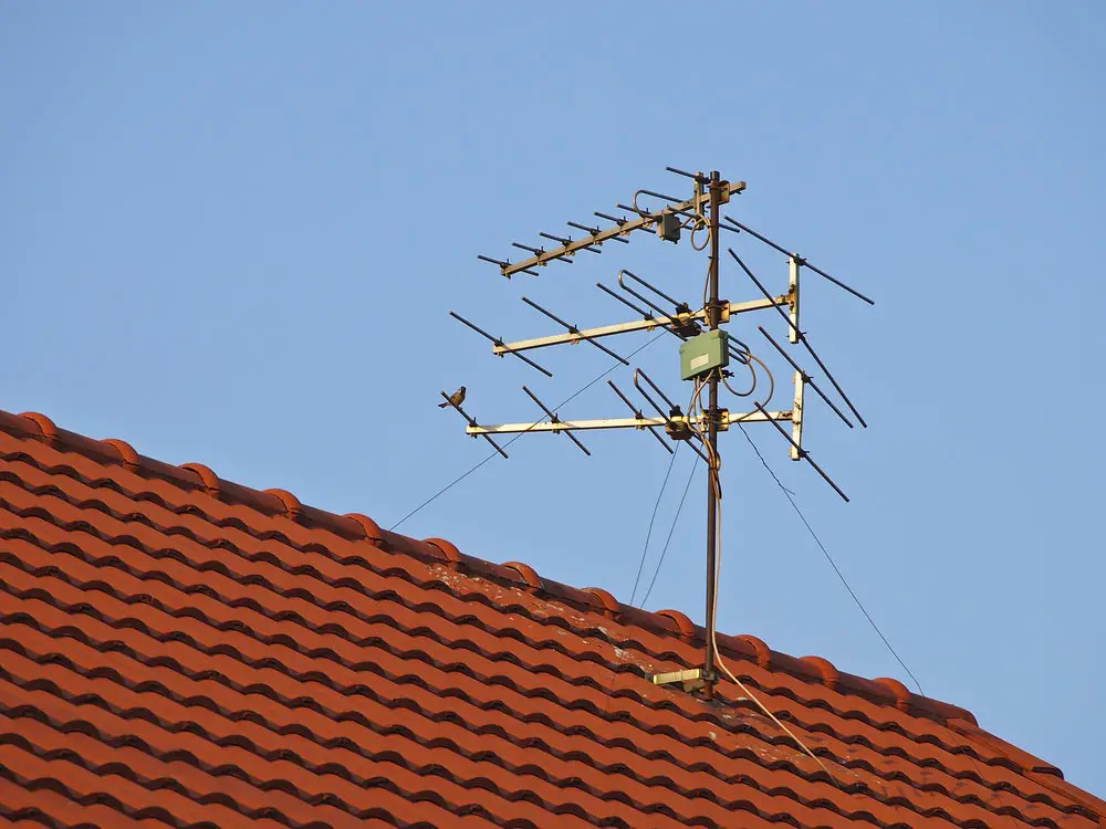 An antenna on a red roof