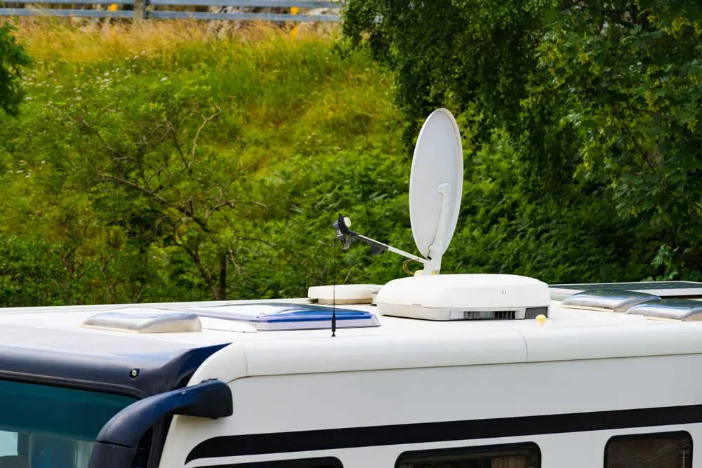 An RV with a satellite dish on the roof