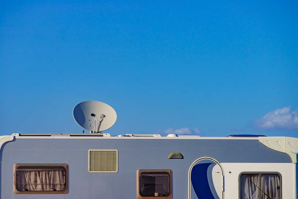 A satellite antenna over a camper